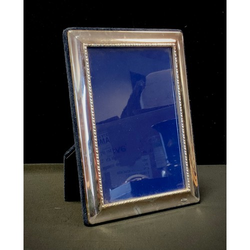 384A - An Elizabeth II silver rectangular easel photograph frame, 18cm high, Sheffield 1998