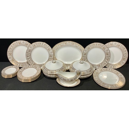 5136 - A Wedgwood Gold Florentine pattern dinner service, comprising pair of vegetable dishes and covers, s... 