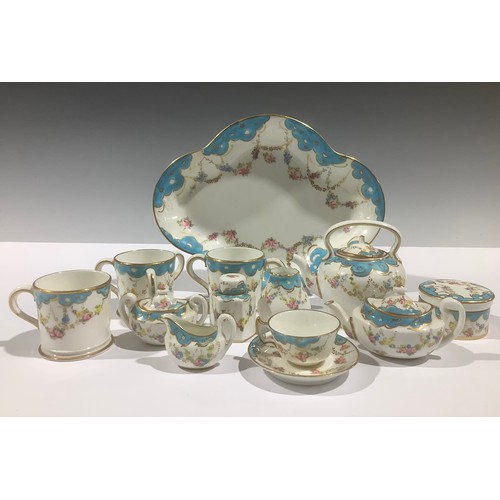 5072 - A Royal Crown Derby miniature tea service, decorated with floral and gilt swags beneath a pale blue ... 