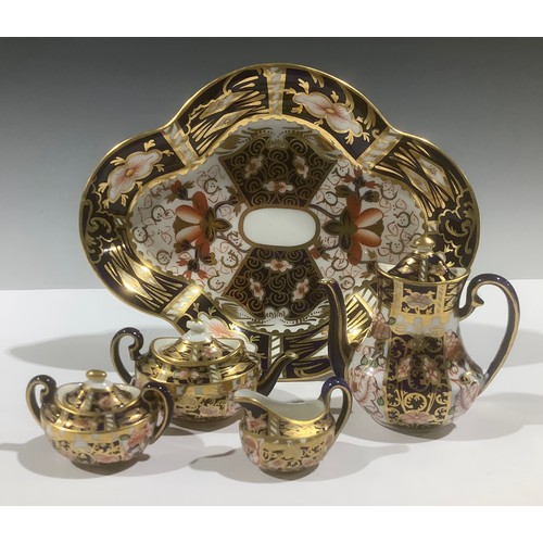 5075 - A Royal Crown Derby 6299 Imari pattern miniature four-piece tea service, on a 2451 pattern quatrefoi... 