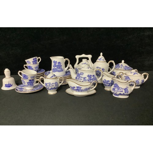 5079 - A Coalport miniature Willow pattern tea and dinner service, printed in blue and white, comprising te... 