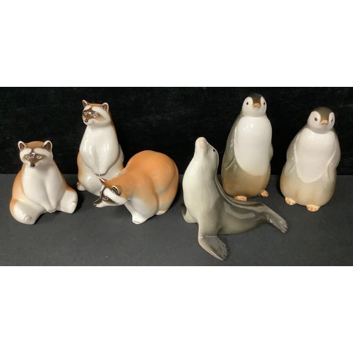 5093 - A pair of Russian Lomonosov porcelain penguins; others, raccoons, seal (6)