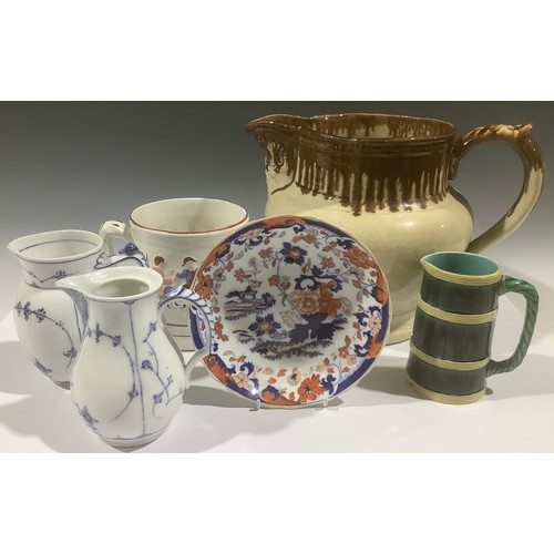 5103 - A Royal Copenhagen blue and white jug, another; a Wedgwood majolica jug as a barrel; a large salt gl... 