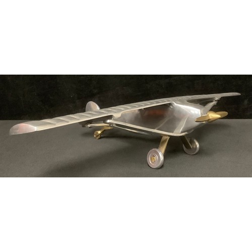 5222 - An aluminium desk model of Charles Lindbergh's Spirit of St. Louis monoplane in which he made the fi... 