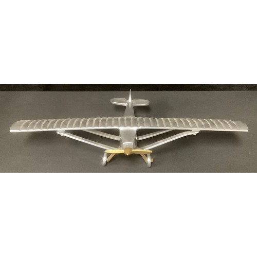 5222 - An aluminium desk model of Charles Lindbergh's Spirit of St. Louis monoplane in which he made the fi... 