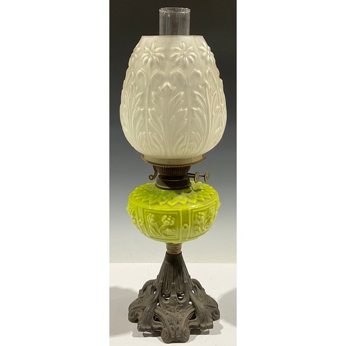 5277 - An ornate Victorian oil lamp, the glass shade decorated with daisies and acanthus, terminating with ... 