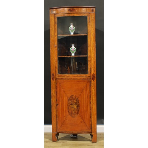 5360 - A Sheraton Revival satinwood and marquetry floor-standing bowfront corner display cabinet, moulded c... 