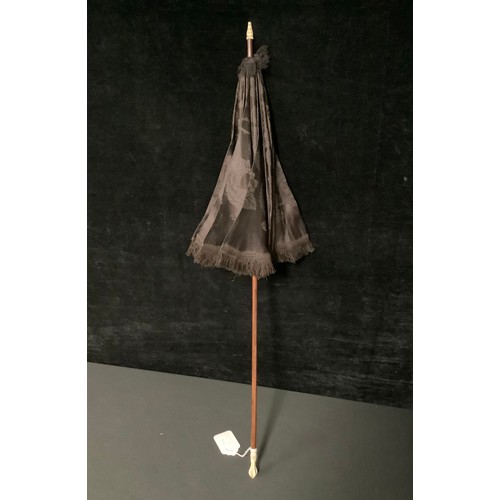 5304 - A late 19th/early 20th century parasol, the Malacca cane with turned and carved bone knop and finial... 