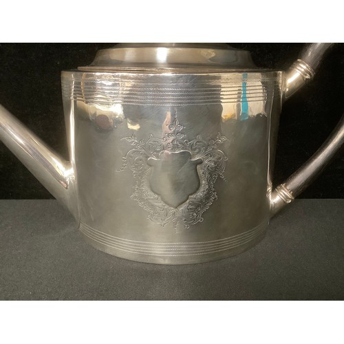 5020 - A George III silver oval teapot, angular spout, ebonised scroll handle and knop, pair of vacant shie... 