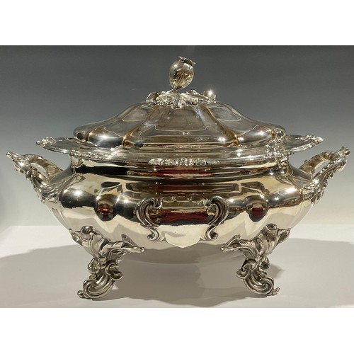 526 - A William IV Old Sheffield plate fluted oval soup tureen and cover, in the Rococo Revival taste, bud... 