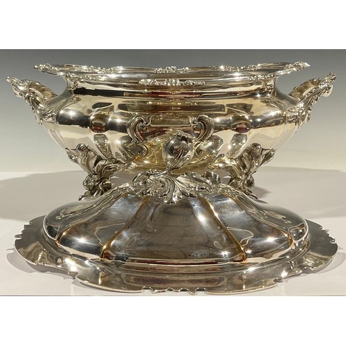 526 - A William IV Old Sheffield plate fluted oval soup tureen and cover, in the Rococo Revival taste, bud... 