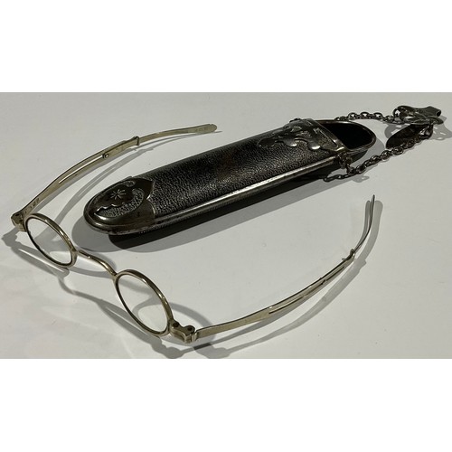 5315 - An Edwardian chatelaine spectacle case, containing a pair of Georgian extendable spectacles (2)