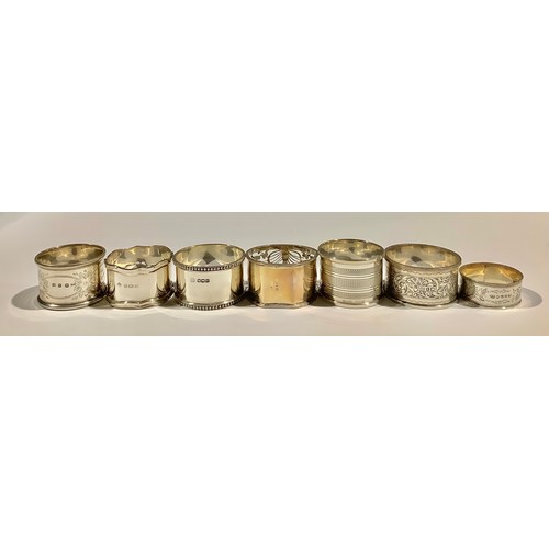 5319 - A Victorian silver napkin ring, Birmingham 1899; other silver napkin rings; 161g (7)