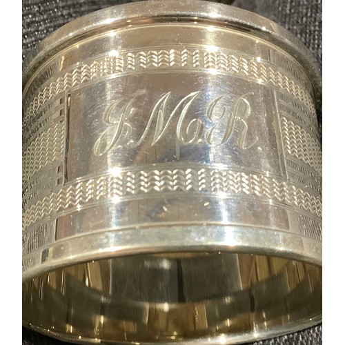 5319 - A Victorian silver napkin ring, Birmingham 1899; other silver napkin rings; 161g (7)