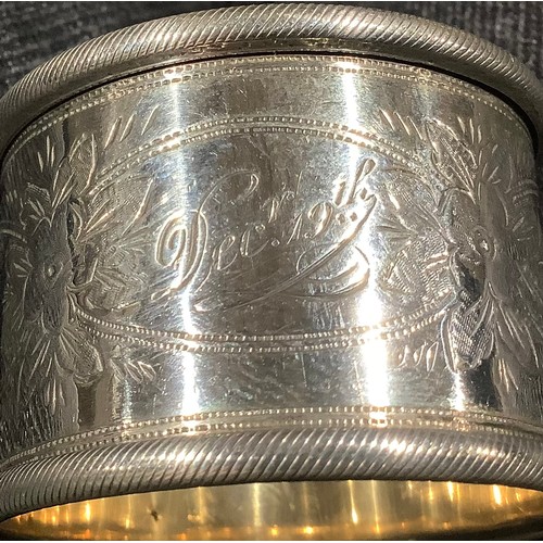 5319 - A Victorian silver napkin ring, Birmingham 1899; other silver napkin rings; 161g (7)