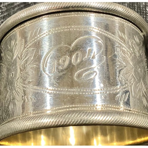 5319 - A Victorian silver napkin ring, Birmingham 1899; other silver napkin rings; 161g (7)