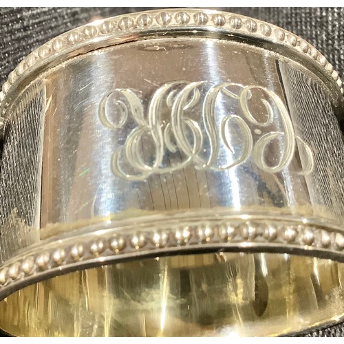 5319 - A Victorian silver napkin ring, Birmingham 1899; other silver napkin rings; 161g (7)