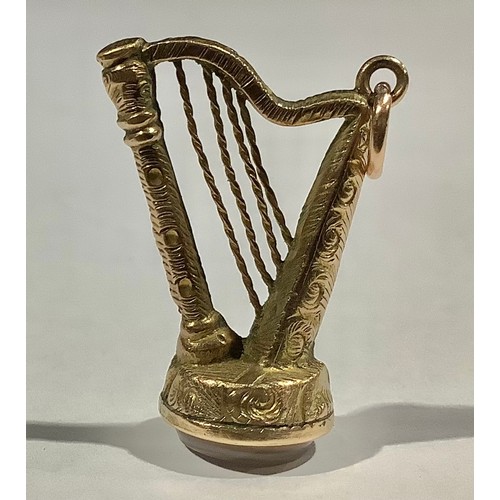 5321 - A Victorian gold coloured Irish harp Albert fob set with stone