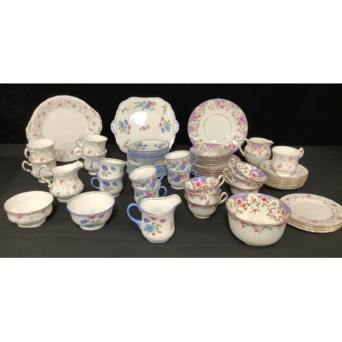 5455 - An Aynsley tea service for six, decorated with stylised pink and blue flowers, comprising cake plate... 