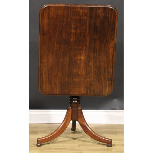 5363A - A 19th century mahogany tripod occasional table, rounded rectangular tilting top, turned column, out... 