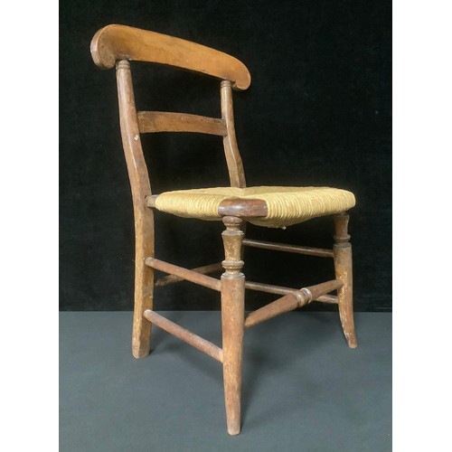 5547 - A late 19th century child's rush seat chair, 61cm