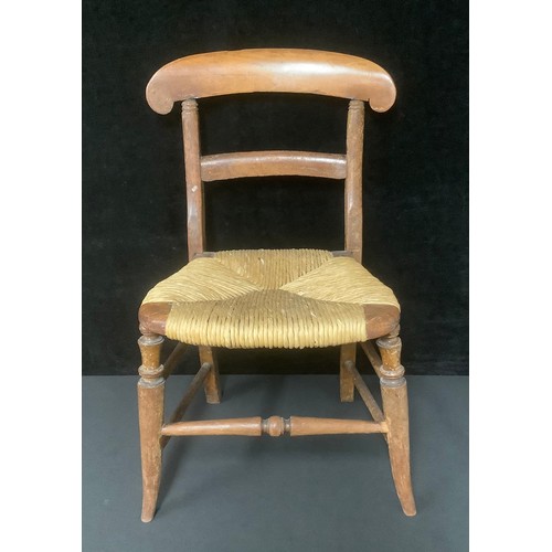 5547 - A late 19th century child's rush seat chair, 61cm