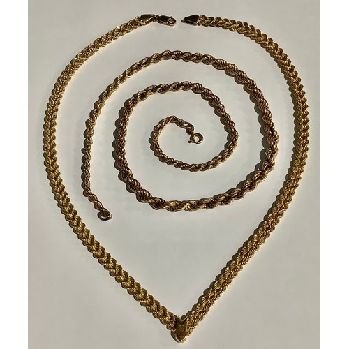 5566 - A 9ct gold fancy link necklace, marked 375, 7.4g; a 9ct gold graduated rope twist necklace, marked 3... 