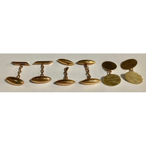 5568 - A pair of 9ct gold oval cuff links, engine turned, marked 375, 6.5g; two other pairs of 9ct rose gol... 