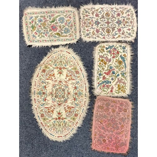 5192 - An Indian Namdha felt oval rug or carpet, embroidered with colourful threads with stylised sailing s... 