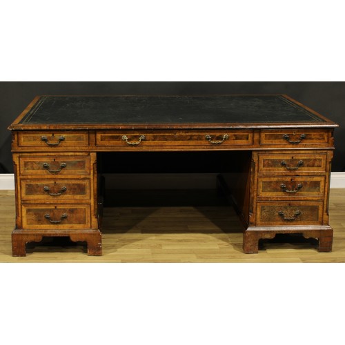 1308A - A George III Revival walnut and mahogany twin pedestal partners’ desk, rectangular top with inset to... 