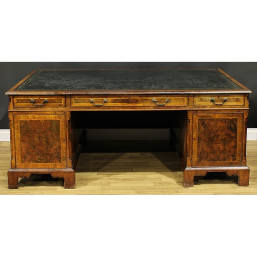 1308A - A George III Revival walnut and mahogany twin pedestal partners’ desk, rectangular top with inset to... 