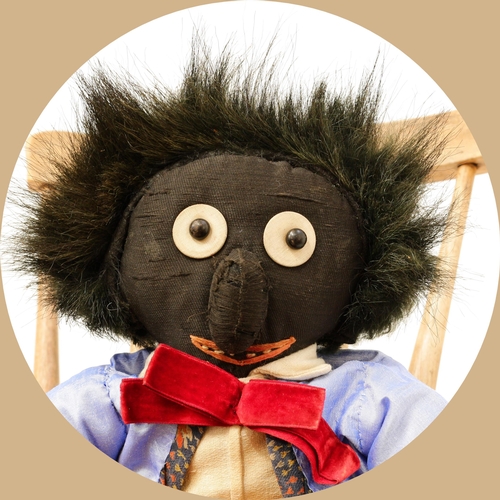 7176 - Toys From The Attic Part II - an early 20th century stuffed cloth black doll, the head applied with ... 