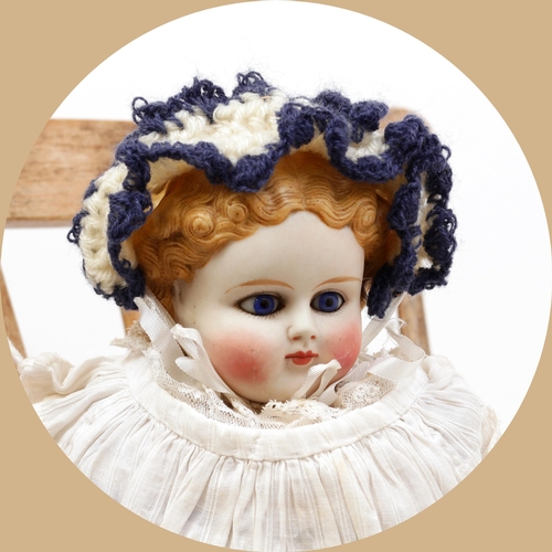 7144 - Toys From The Attic Part II - a 19th century unglazed Parian type shoulder head doll, the pale ungla... 