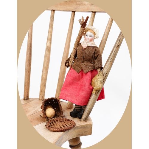 7194 - Toys From The Attic Part II - a late 19th century bisque shoulder head miniature doll, as a fisherwo... 