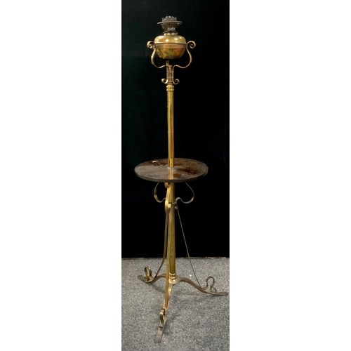 62 - A 20th century floor standard oil lamp and stand, gilt metal scroll tri-pod feet and oil burner, mah... 