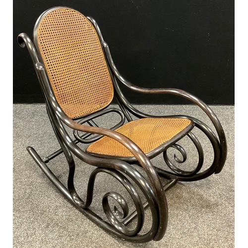 68 - A mid 20th century Thonet, model number 10, bentwood rocking chair, Bergere weave to back and seat, ... 