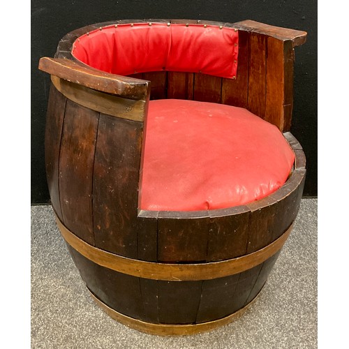 75 - A large oak barrel converted for use as a garden seat, 68cm high x 66cm wide.