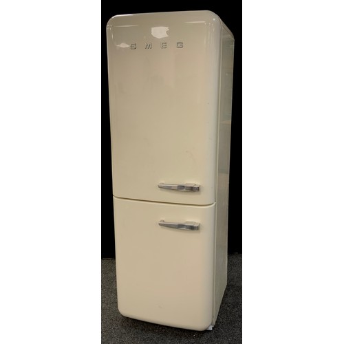 147 - A freestanding smeg fridge freezer in cream with left-hand hinge. Model no. S32STRP3, serial no. 509... 