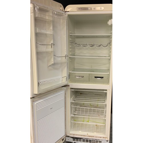 147 - A freestanding smeg fridge freezer in cream with left-hand hinge. Model no. S32STRP3, serial no. 509... 