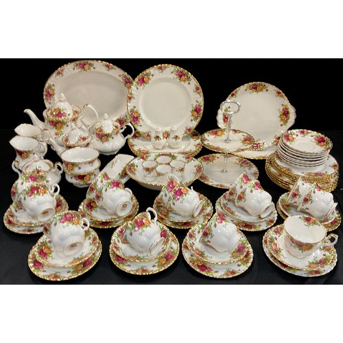 176 - A Royal Albert ‘Old Country House roses’ part table service for eight including; four dinner plates,... 