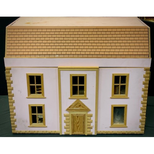 188 - A late 20th century two story dolls house, including miniature furniture; etc. 70cm high x 82cm wide... 