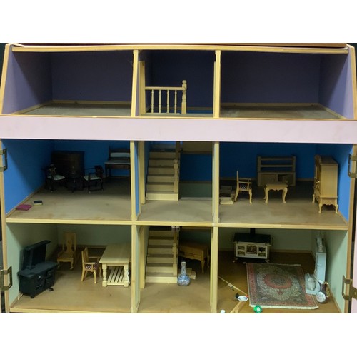 188 - A late 20th century two story dolls house, including miniature furniture; etc. 70cm high x 82cm wide... 