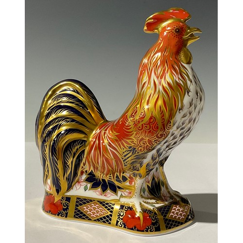 5189 - A Royal Crown Derby paperweight, The Fighting Cockerel, Sinclairs exclusive, the base accented in th... 