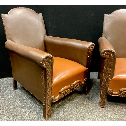 193 - A pair of Arts and Crafts style carved oak and leatherette armchairs, 88.5cm high x 72cm wide x 70cm... 