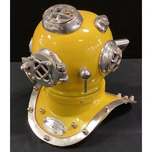 231 - A novelty yellow U.S Navy Diving Helmet, 18cm high