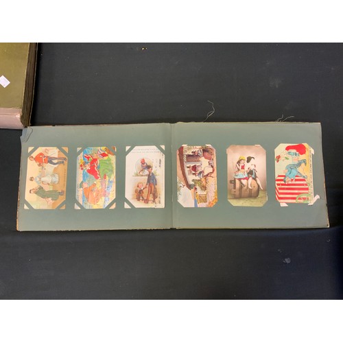 254 - Two Edwardian and later postcard albums mostly humorous and risqué cards inc Donald McGill, Reg Maur... 