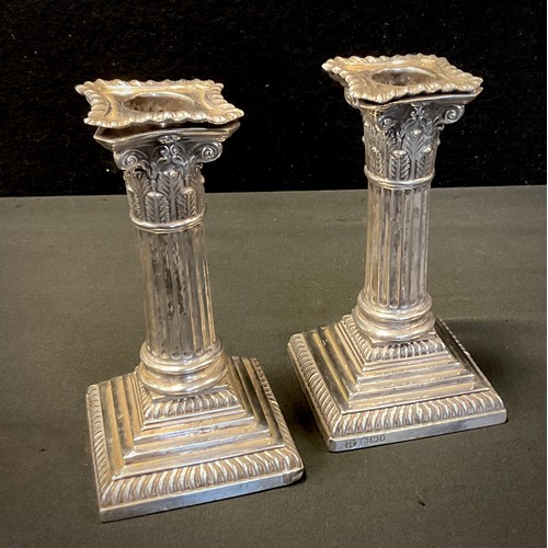 292 - A pair of late Victorian silver Corinthian column candlesticks, weighted bases, 14.5cm high, Sheffie... 