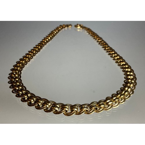 319 - A fancy multi loop link yellow metal necklace, stamped 9k, 50cm long, 1.2cm wide, 26.7g