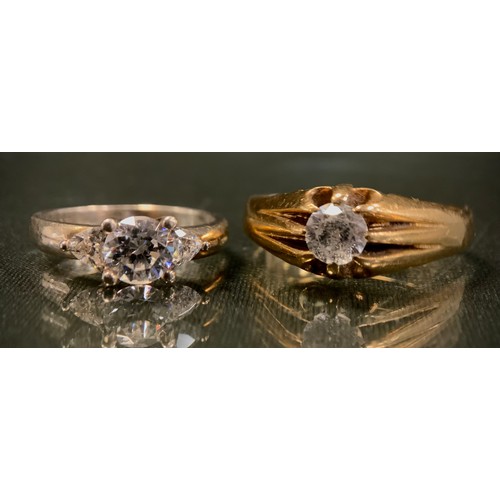 330 - A 9ct gold cz solitaire signet ring, stamped 9ct, size Z, 7g gross;  925 silver DQCZ dress ring (2)