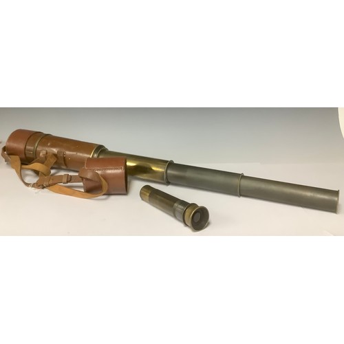 3040 - A brass four draw telescope, brown leather case with strap